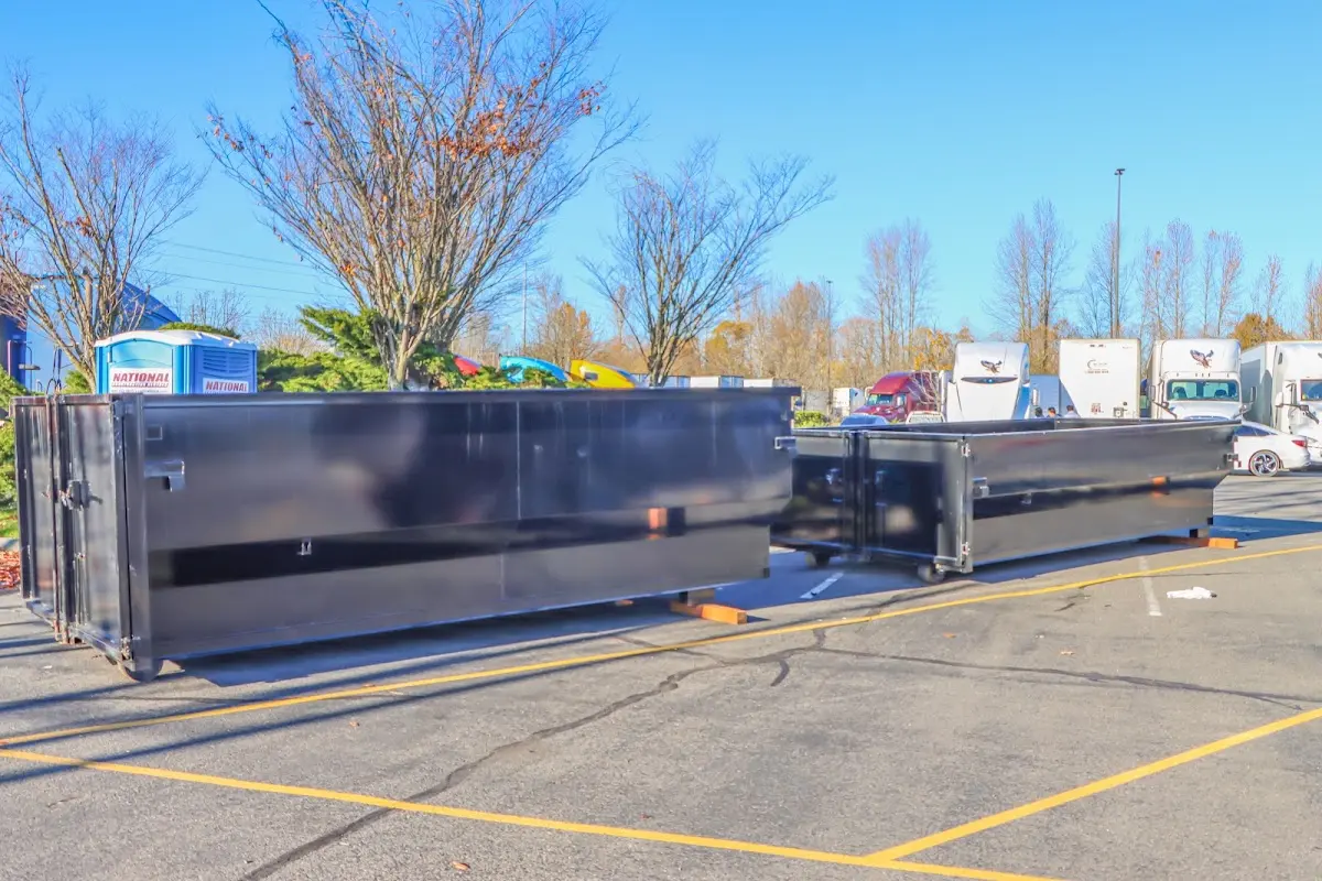 Professional dumpster rental service with roll-off container on residential driveway in North Chicago